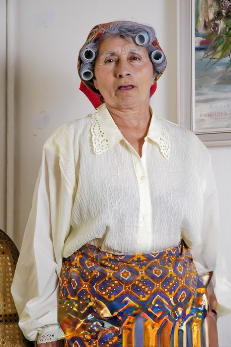 Kinky granny Miss Pinay masturbates while waiting for her hair to curl