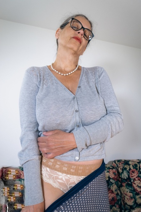 Naughty granny Busty Tina shows off her big boobs and her hairy cunt