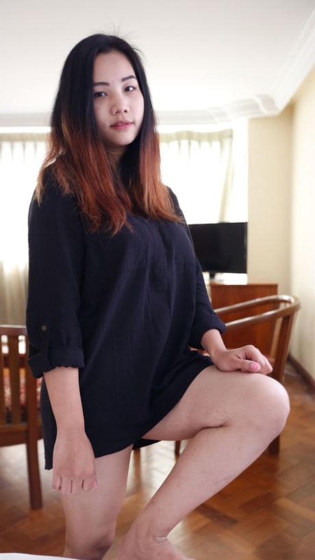 Beautiful Asian babe Meew shows off her stunning big boobs up close